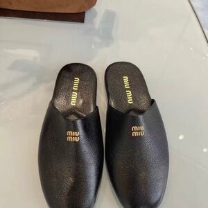 Miu Miu Black Leather Slip-On Logo Mules with Gold Tone Branding